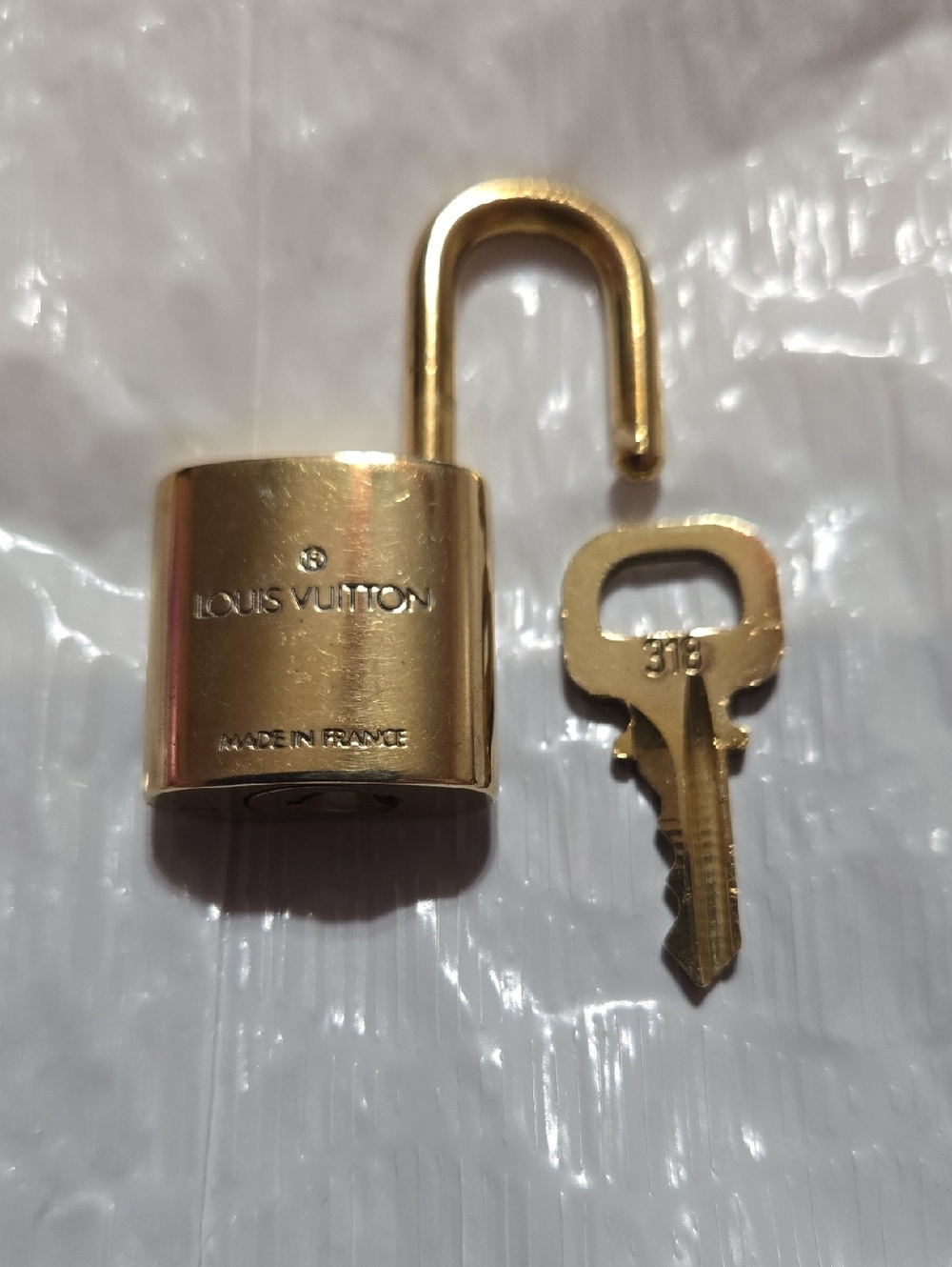 Louis Vuitton Gold Padlock Set of Four with LV Monogram - Picture 5 of 6
